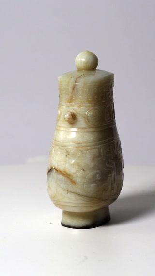 Thumbnail of AN ARCHAISTIC BRONZE-FORM JADE VASE AND COVER, HU Song-Ming dynasty video 1